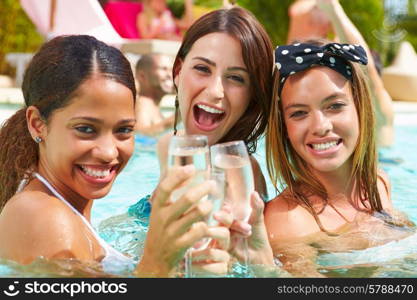 Three Women Having Party In Swimming Pool Drinking Champagne