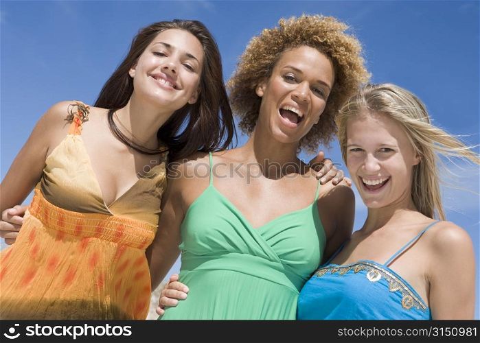 Three women posing outdoors