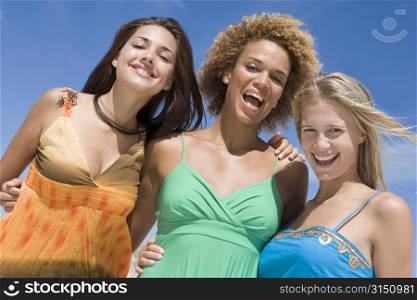 Three women posing outdoors