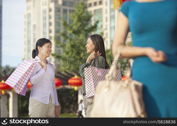 Three Women With Shopping Bags