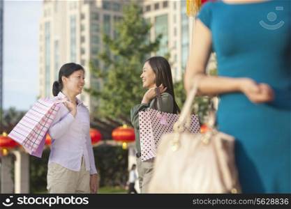 Three Women With Shopping Bags