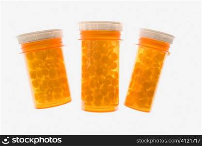 Three Yellow Plastic Medicine Bottles. Isolated