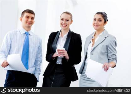 Three young business people laughing. Image of three young businesspeople laughing joyfully