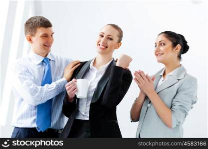 Three young business people laughing. Image of three young businesspeople laughing joyfully