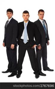 Three young businessmen stand semicircle