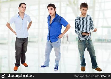 three young casual men standing