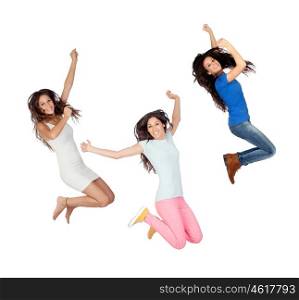 Three young girls jumping isolated on a white background