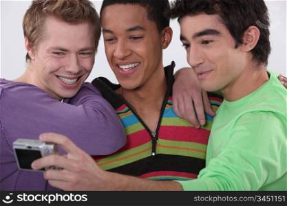 Three young men taking a photo of themselves