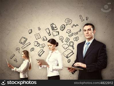 Three young people in business suits. Three young people in business suits with tablet pc in hands