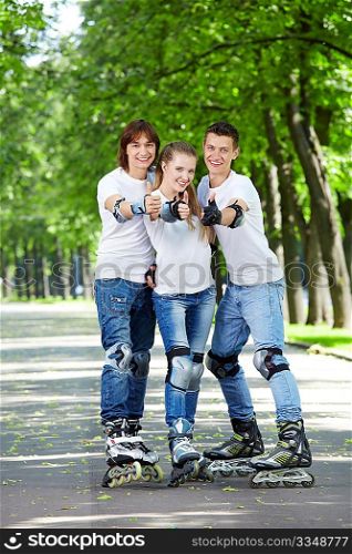 Three young people on the rolls show a big thumbs up