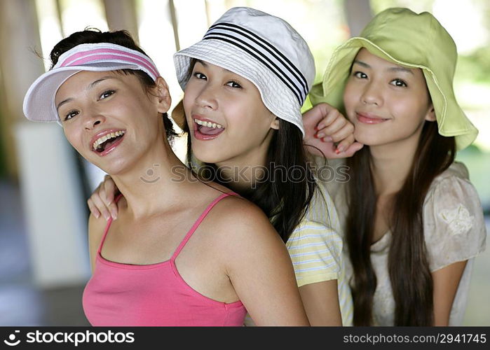 Three young women smiling