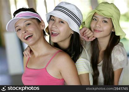 Three young women smiling