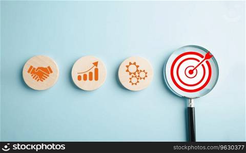 Through the magnifying glass, a businessman focuses on the target goal icon, illustrating the essential strategies, corporate development, and global business leadership for success in the industry.