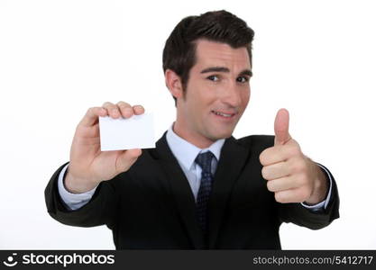 Thumbs up form n executive with blank business card