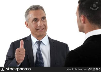 Thumbs up from a businessman
