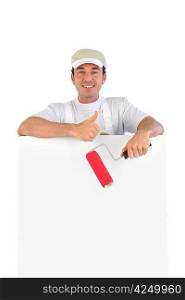 Thumbs up from a decorator with a blank board