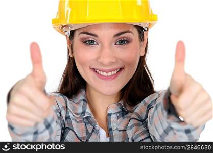 Thumbs up from a female construction worker