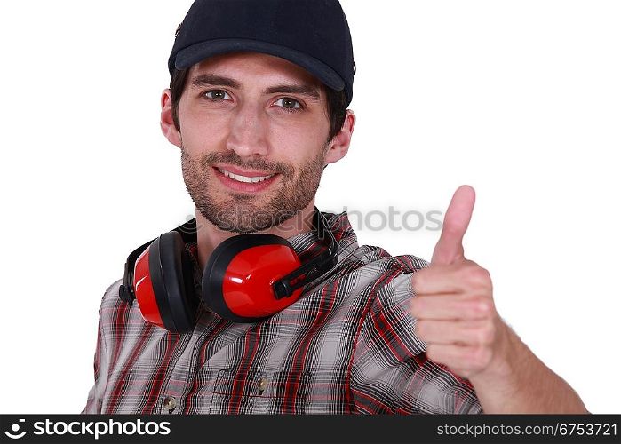 Thumbs up from a man with ear defenders