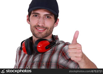 Thumbs up from a man with ear defenders