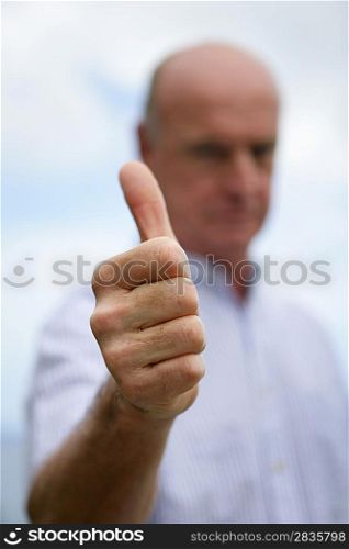 Thumbs up from a senior man