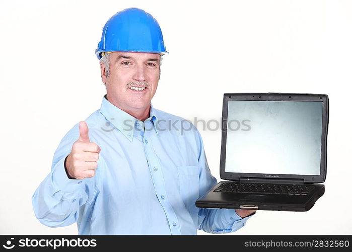 Thumbs up from an engineer with a laptop