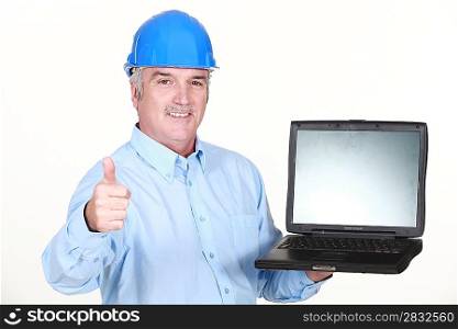 Thumbs up from an engineer with a laptop