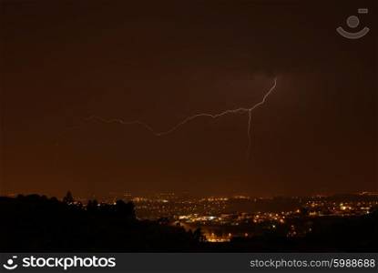 thunder at night over a city in portugal