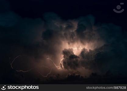 Thundercloud with beautiful lightning bolts in night sky