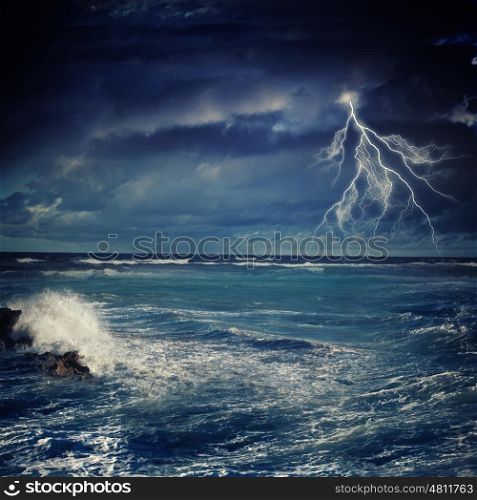 Thunderstorm in sea. Image of night stormy sea with big waves and lightning