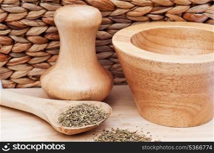 Thyme herb with wooden utensils in rustic kitchen scene
