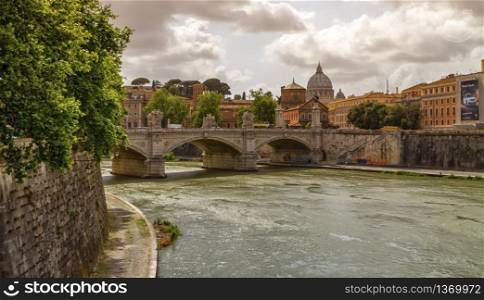 Tiber river, Ponte Sant&rsquo;Angelo and St. Peter&rsquo;s cathedral by cloudy day, Roma, Italy. Tiber river, Ponte Sant&rsquo;Angelo and St. Peter&rsquo;s cathedral, Roma, Italy