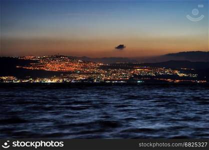 Tiberias city lights late at night on the Sea of Galilee. Tiberias city lights