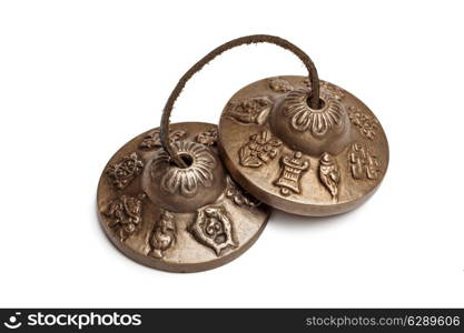 Tibetan Buddhist tingsha cymbals isolated on white