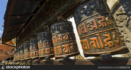 Tibetan copper prayer wheels, Swayambhunath Temple, Monkey Temple, UNESCO World Heritage Siite, Kathmandu, Nepal, Asia