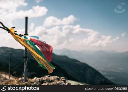 Tibetan flags flutter in the wind in the summit of Untersberg mountain, Austria