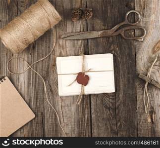 tied up with a rope a stack of empty cards on a gray wooden table, top view