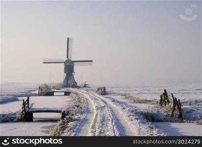 Tiendwegse mill near Hardinxveld-Giessendam in the Dutch region Alblasserwaard in winter mood. Tiendwegse mill in winter