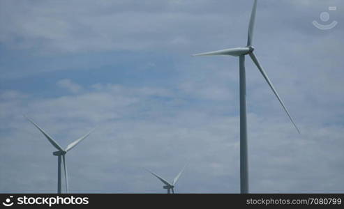 Tight view of three turbines in a Californian wind farm