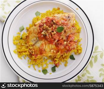 Tilapia Fillets with Yellow Rice and Vegetables