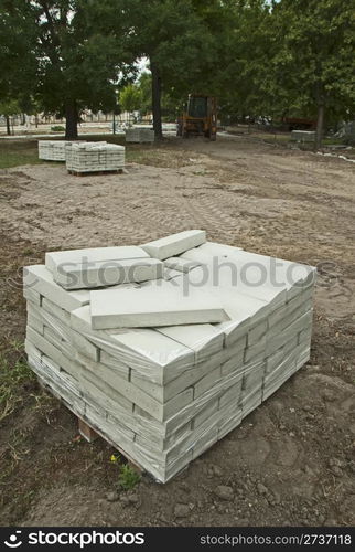 Tile paths construction in park.