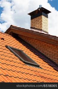 Tiled roof with attic window. attic window