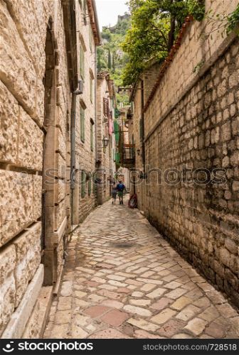 Tiled surface of pedestrian streets of old town Kotor in Montenegro. Narrow streets in the Old Town of Kotor in Montenegro