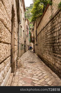 Tiled surface of pedestrian streets of old town Kotor in Montenegro. Narrow streets in the Old Town of Kotor in Montenegro