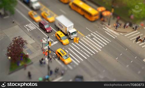 Tilt shift aerial view of busy intersection