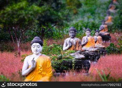 Tilt shift blur effect. Amazing view of lot Buddhas statues in Loumani Buddha Garden. Hpa-An, Myanmar (Burma) travel landscapes and destinations