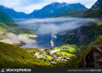 Tilt shift lens - Geiranger fjord, Beautiful Nature Norway. It is a 15-kilometre (9.3 mi) long branch off of the Sunnylvsfjorden, which is a branch off of the Storfjorden (Great Fjord).