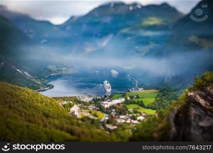 Tilt shift lens - Geiranger fjord, Beautiful Nature Norway. It is a 15-kilometre (9.3 mi) long branch off of the Sunnylvsfjorden, which is a branch off of the Storfjorden (Great Fjord).