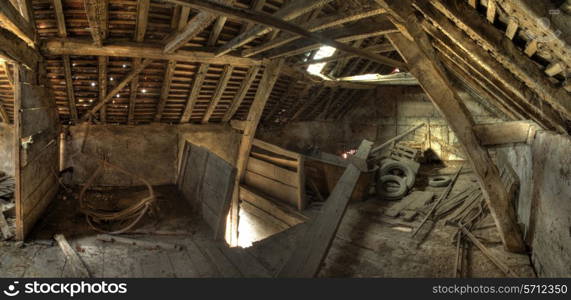 Timber-frame and wattle and daub constructed English granary interior.