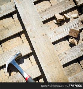 Timber off-cuts, sawdust and tools on a construction site