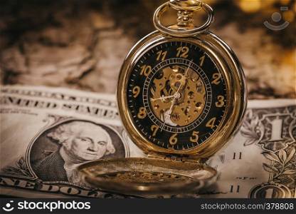 Time and money concept image - pocket watch and US currency